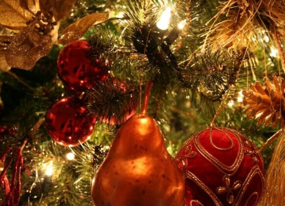 Christmas decors and lights hanging on a Christmas tree