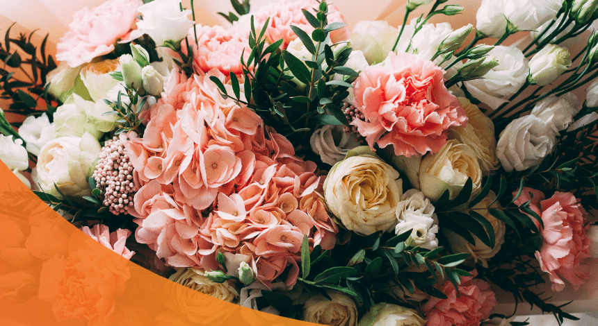 Roses, carnations, and other flowers arranged in a bouquet