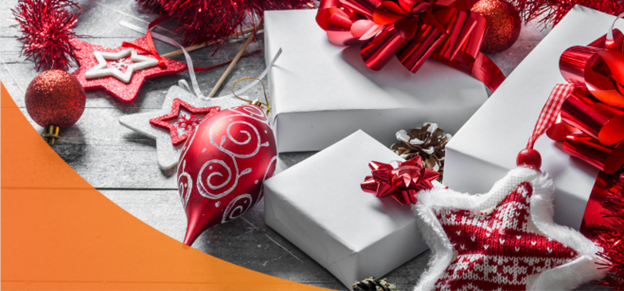 Pile of gifts and ornaments on a wood table for last-minute Christmas gifts